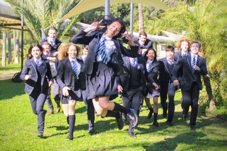international-students-jumping-in-the-garden